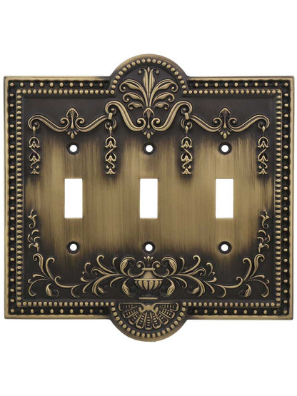 Como Triple Toggle Switch Plate in Antique Brass.